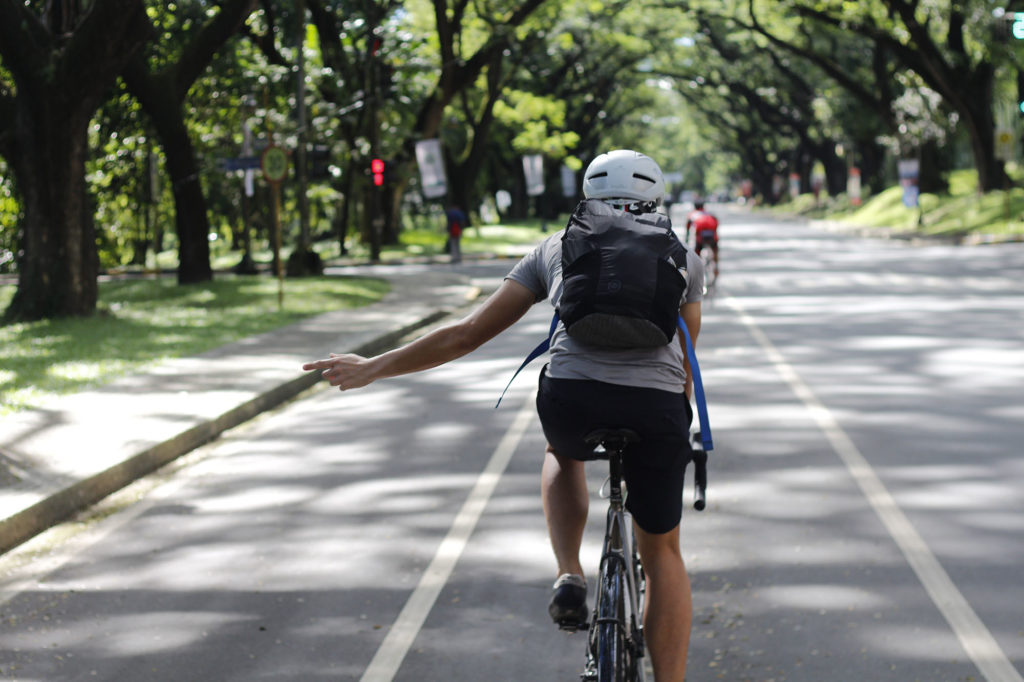 Turning left cycling hand signal