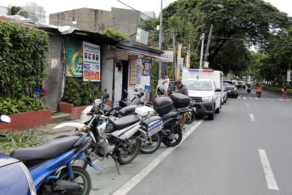 Police mobile and motorcycles parked on the bike lane